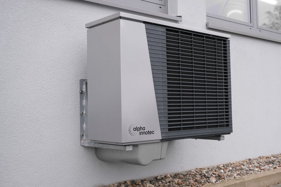 Accueil Outdoor air conditioning unit mounted on a residential building exterior.